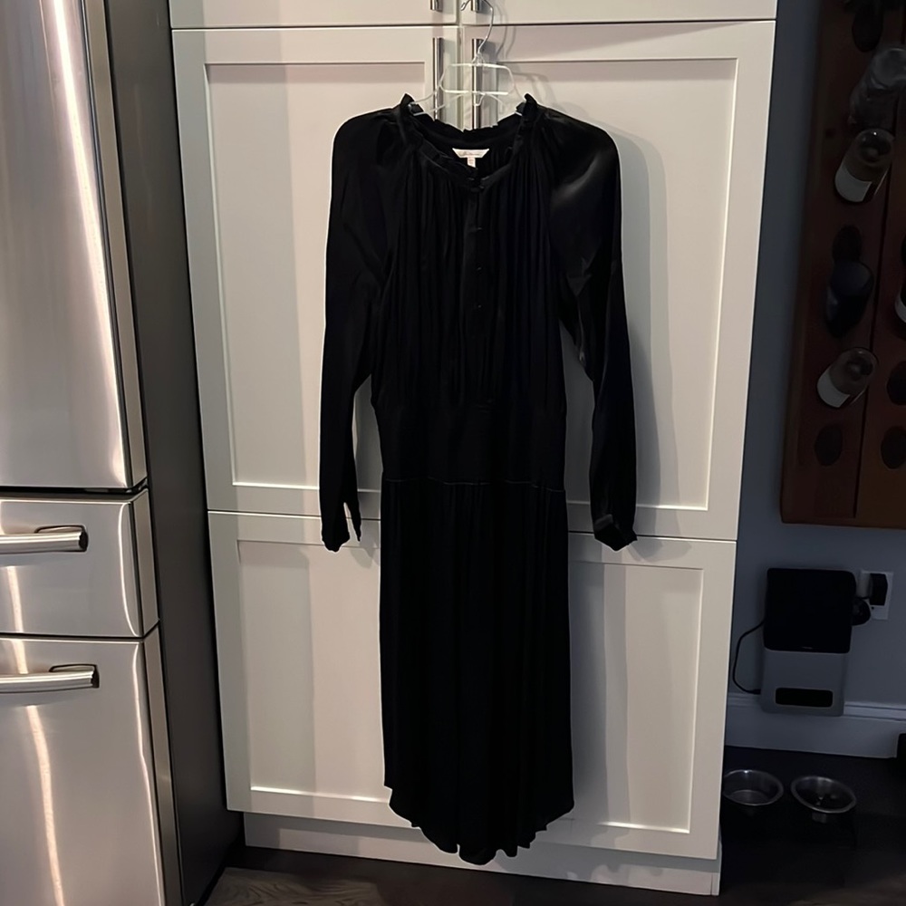 Black silky/satin dress with elasticized waist. Button close at top.